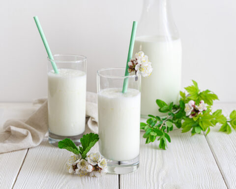 Traditional,Milk,Drink,On,A,White,Background,With,Greenery,And